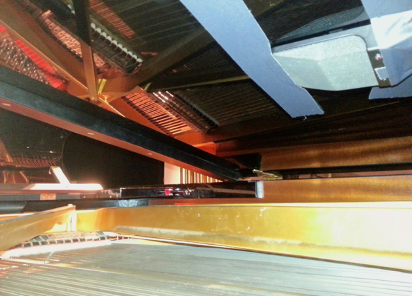 Spot mic inside piano at live concert