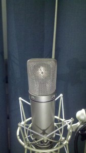 Neumann u87 condenser microphone rear view with mic element reflection and spider shockmount
