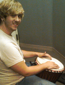 Drummer Austin Farmer plays djembe for microphone comparison